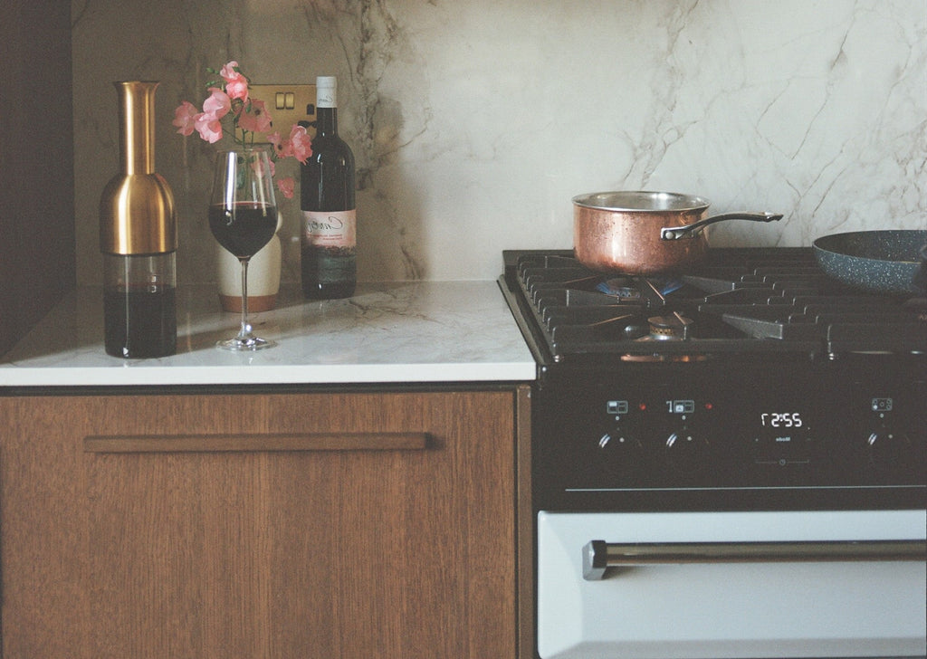 eto in Brass satin finish on top of a kitchen counter