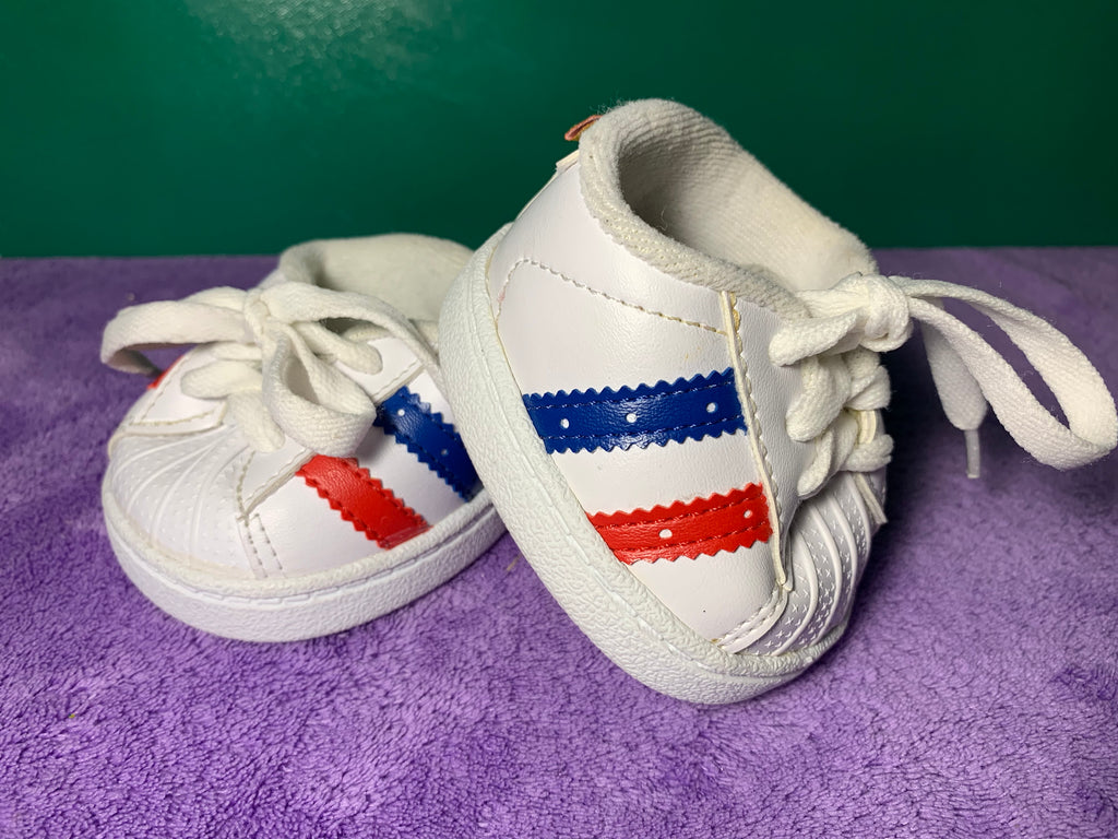 white sneakers with red and blue stripes