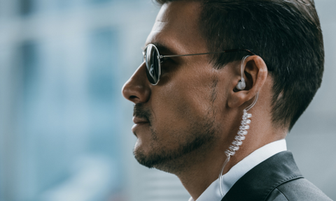 FBI agent wearing acoustic tube earpiece