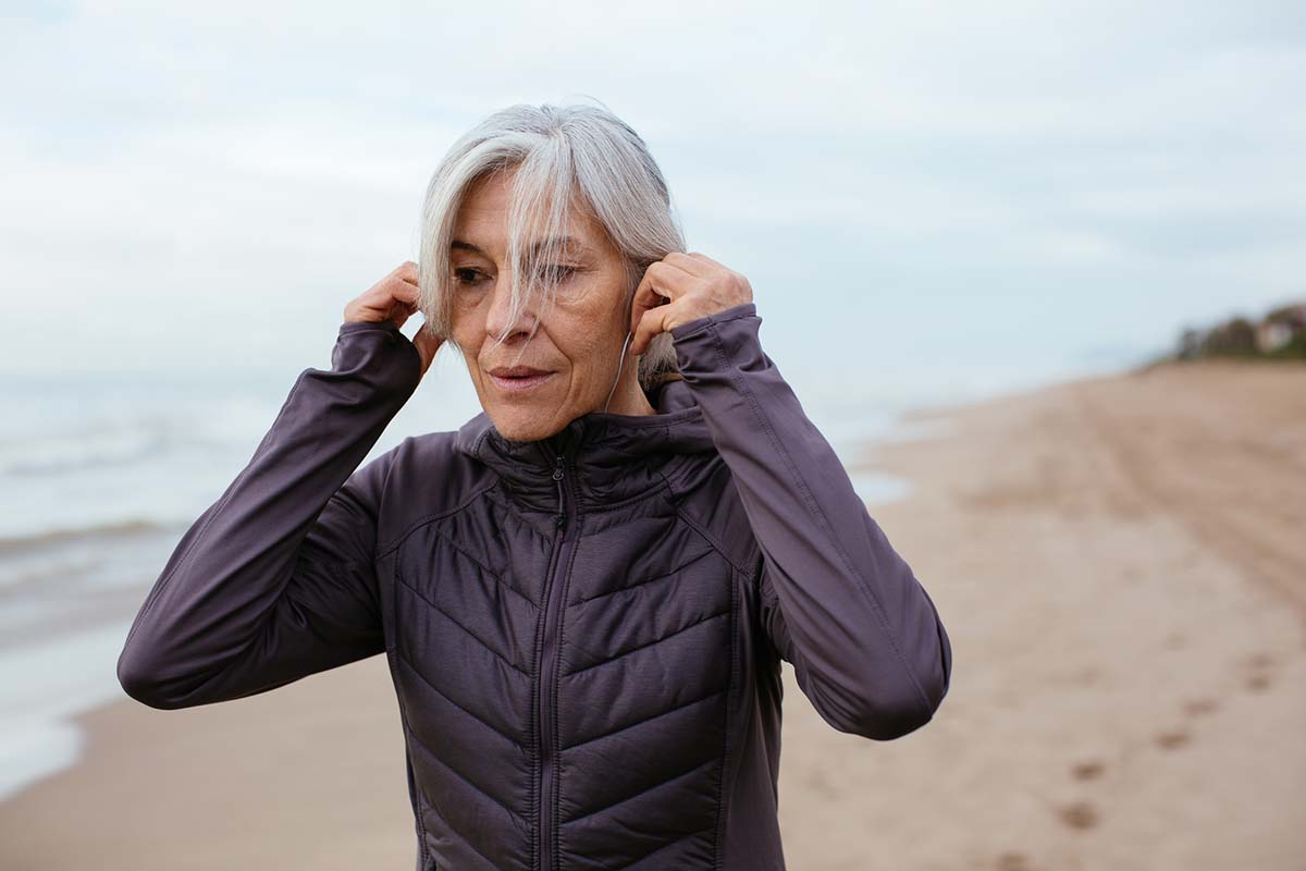 Woman exercising on beach, from Unsplash