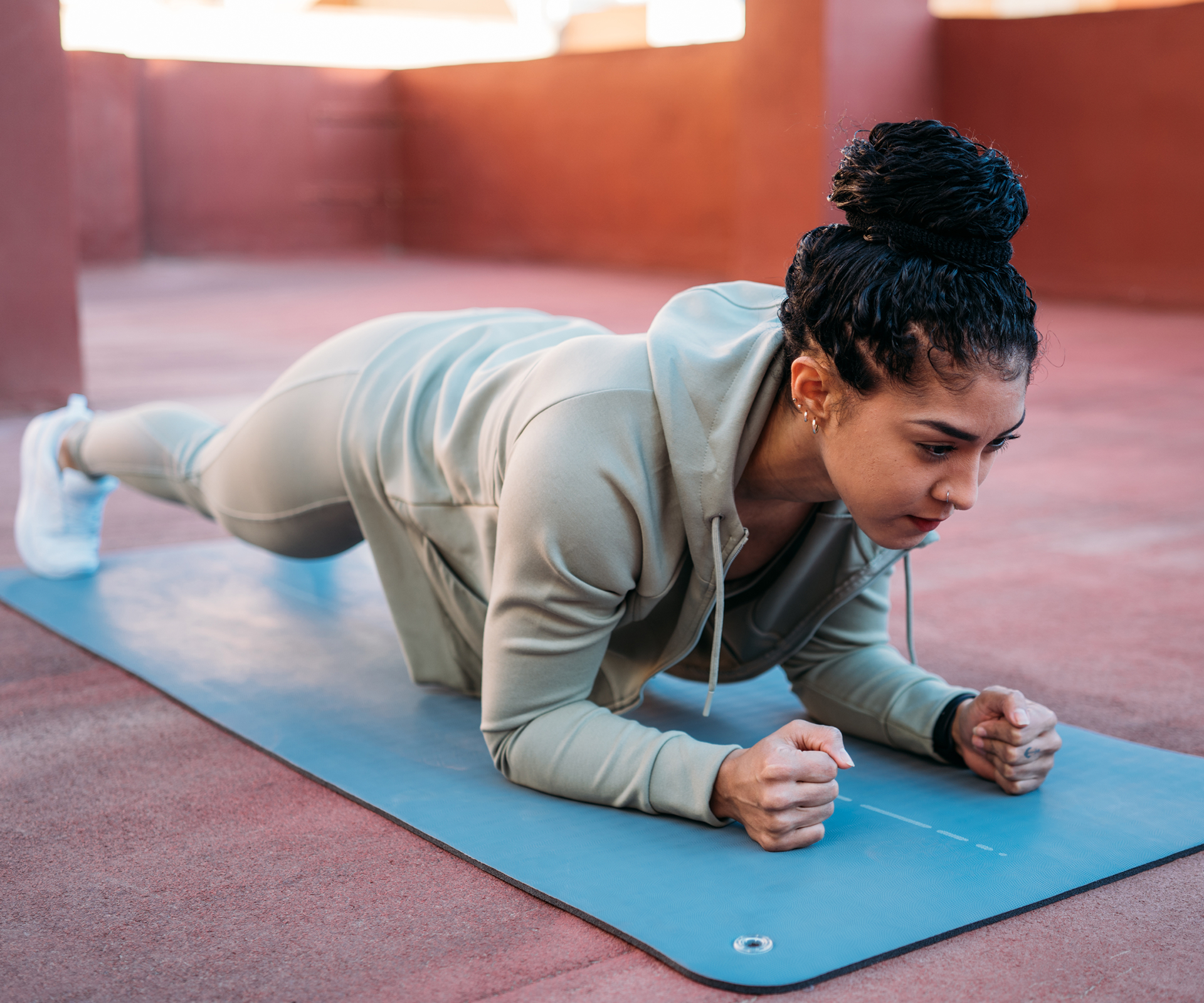 A woman working out on a yoga mat