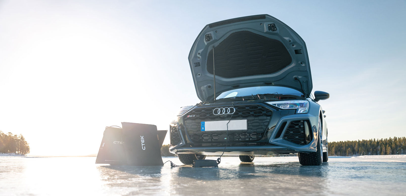 CTEK CS FREE charging a car on a frozen lake