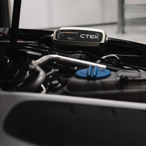 CTEK MXS 5.0 battery charger attached to a car battery
