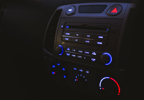 Black car radio with blue electronic buttons