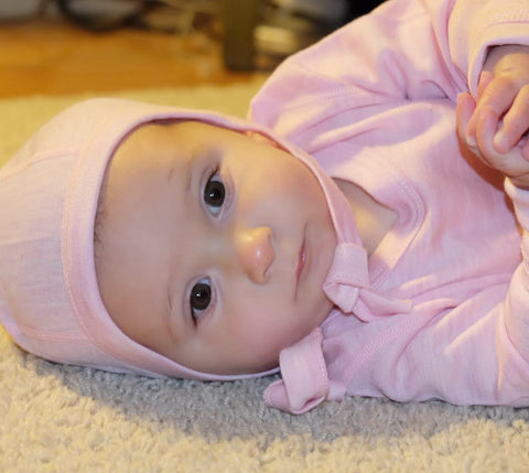 Baby girl in pink Base layer set - Photo by Amelia Mayer