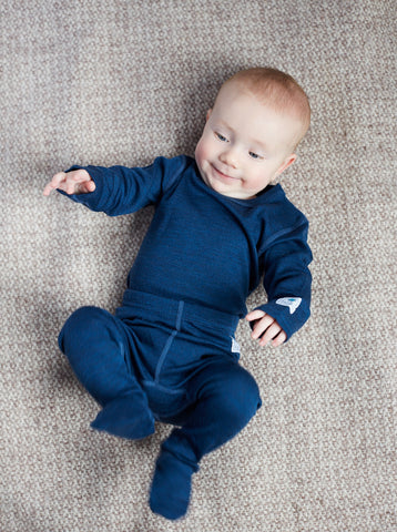 baby boy wearing blue base layer set