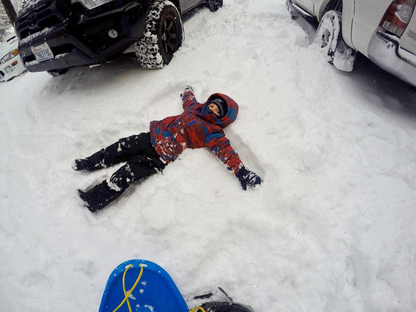 a kid making a snow angel