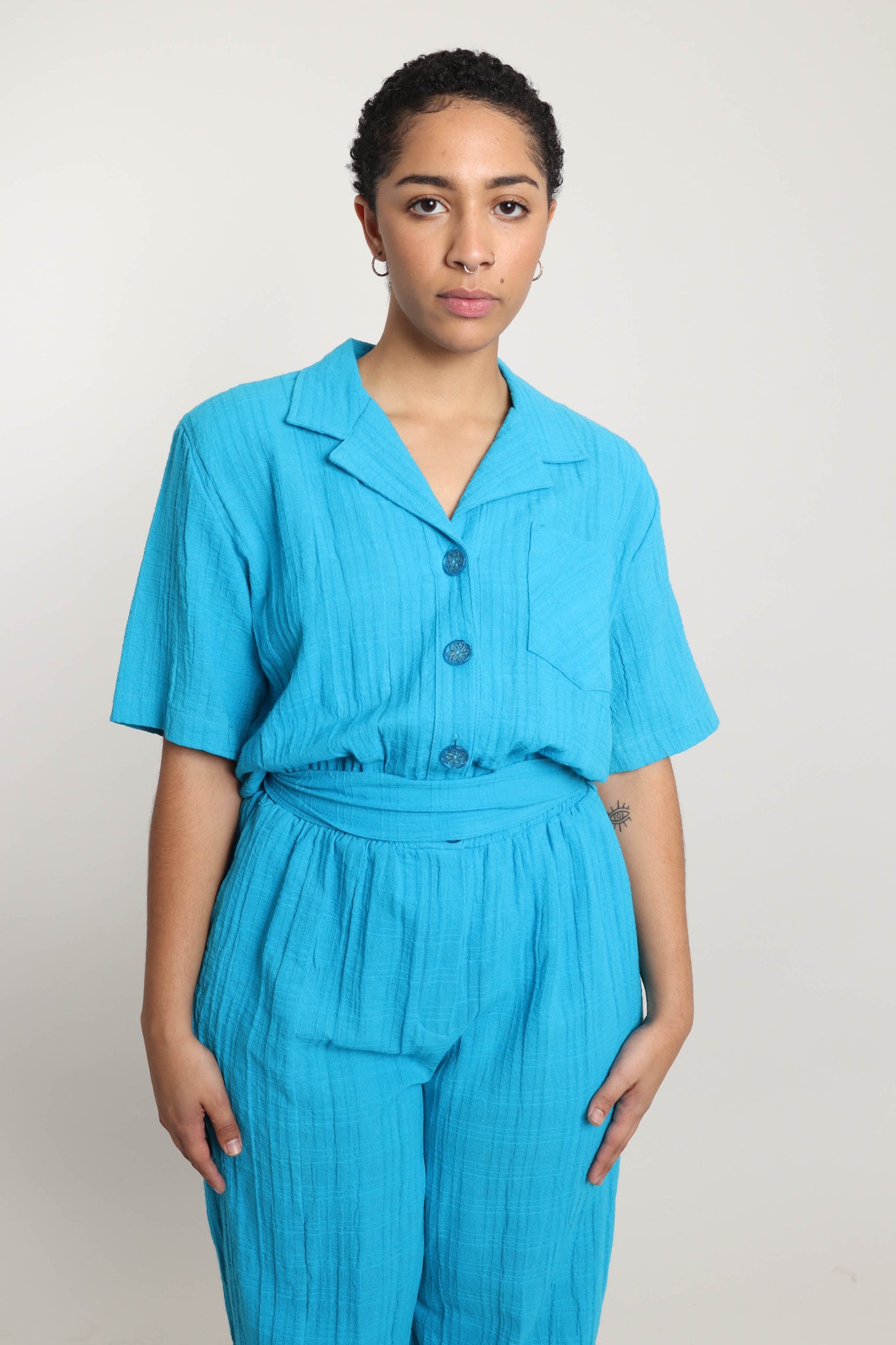 blue 80s jumpsuit