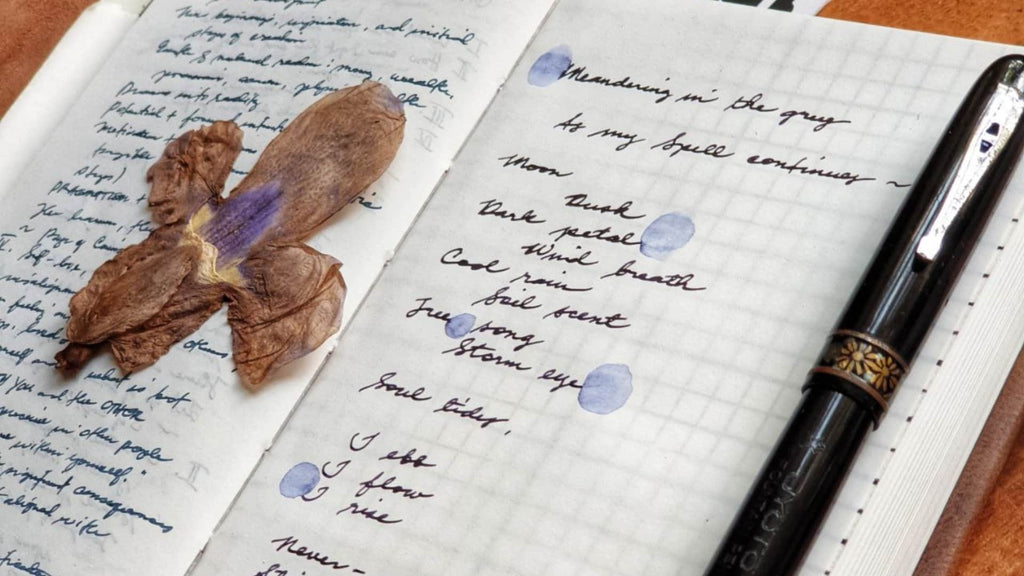 Interwined: EndlessPens Celebrates Handwritten Poetry - Dried Flowers On Top Of Notebook