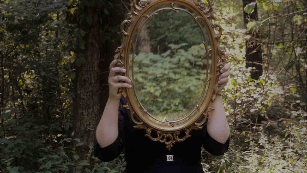 Through the Darkness: EndlessPens Celebrates Writers, Part V - A Person Holding A Mirror