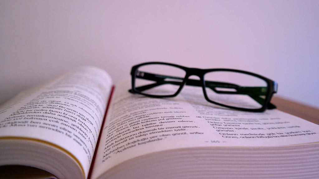 Weaving Meaning Into Words - Book and Glasses