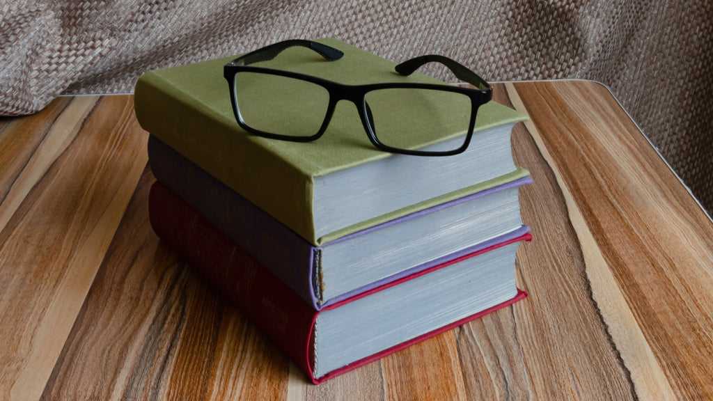 Contemporary Light: EndlessPens Celebrates Writers, Part XV - Eyeglasses On Top Of Stack Of Books