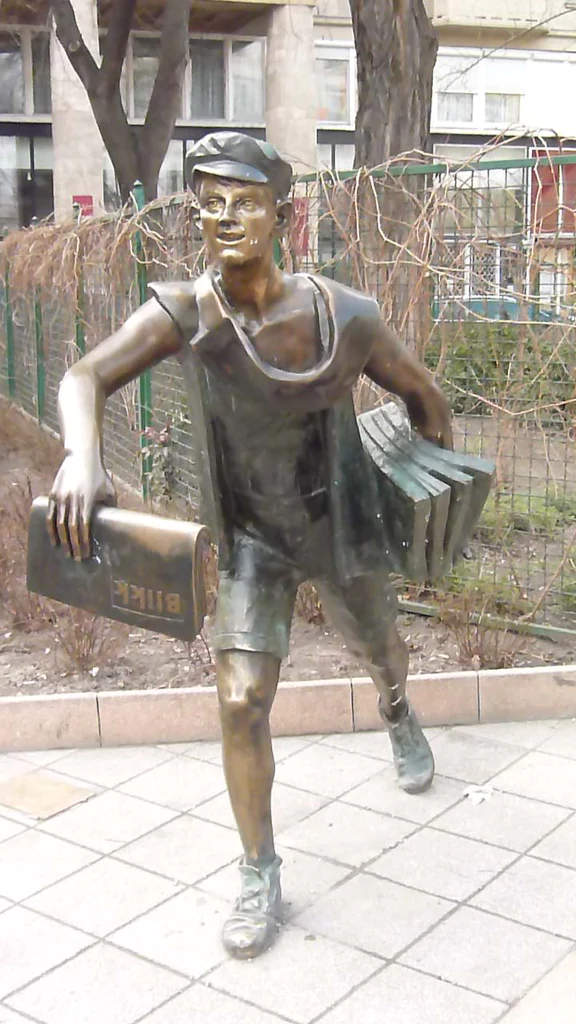 statue of a newspaper boy