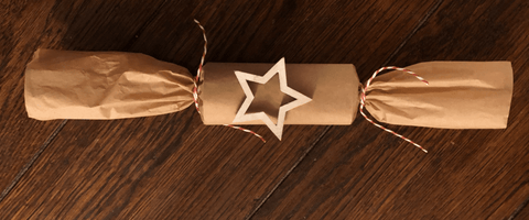 Brown paper wrapped snapping cracker.