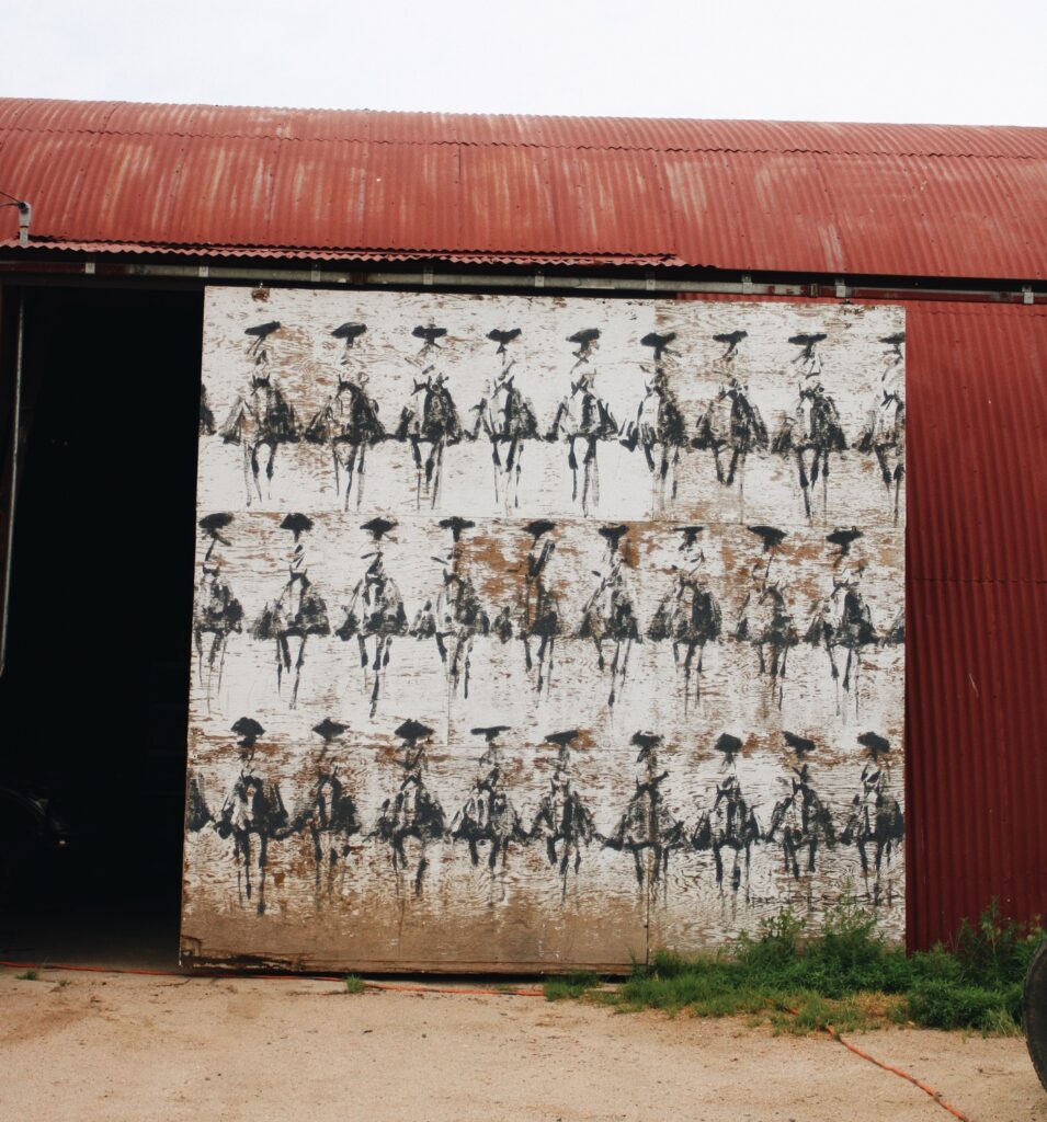 The Quonset door at Chico Basin Ranch, hand painted this summer by Beardsley with his signature rider motif.