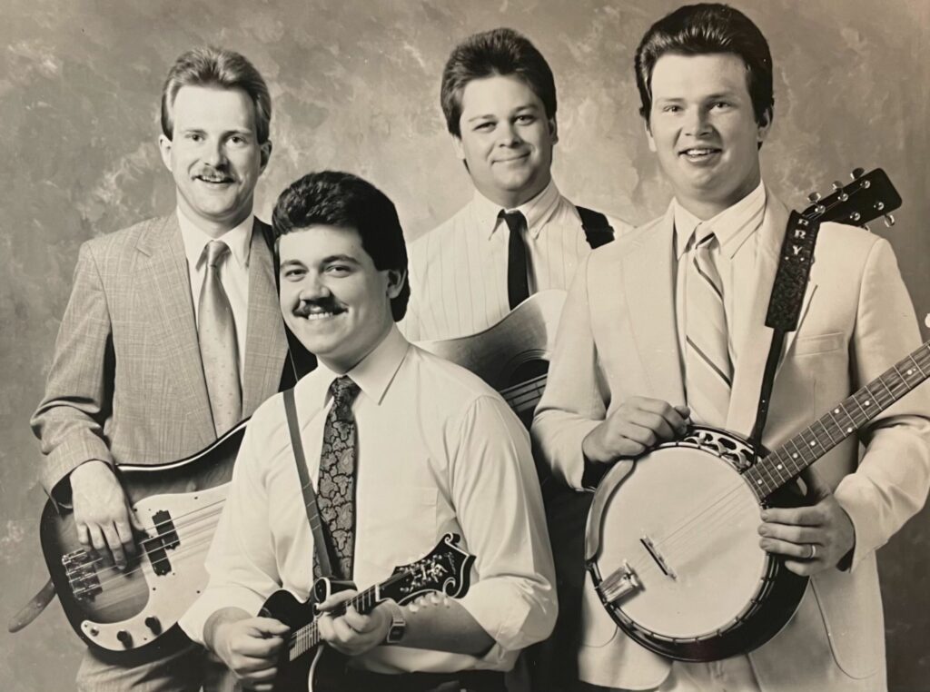 Tyminski (front) with the Lonesome River Band in 1988. He initially hoped to join the band as a banjo player, but was asked to join as the mandolin player. He saw the opportunity and accepted. Photo courtesy of Dan Tyminski.