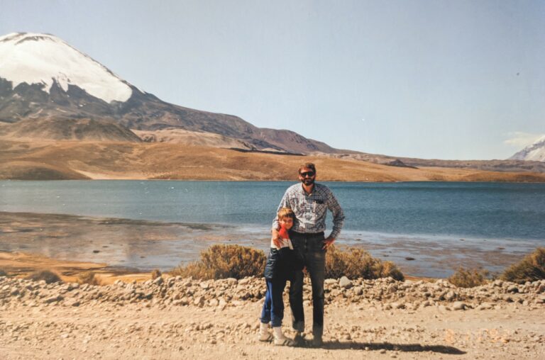 Grossmann and his father visiting Lake Chungará (approx 15,000 ft above sea level), with the volcano Parinacota (approx 20,800 ft above sea level) in the background.