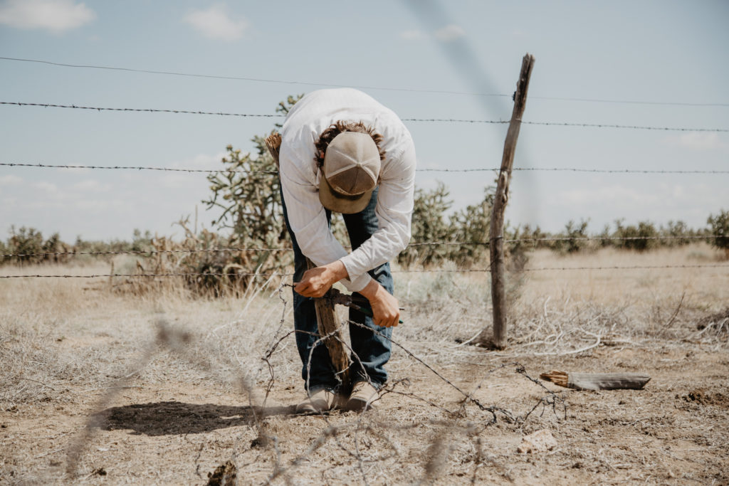 Michael fixing fence on July 23, 2018