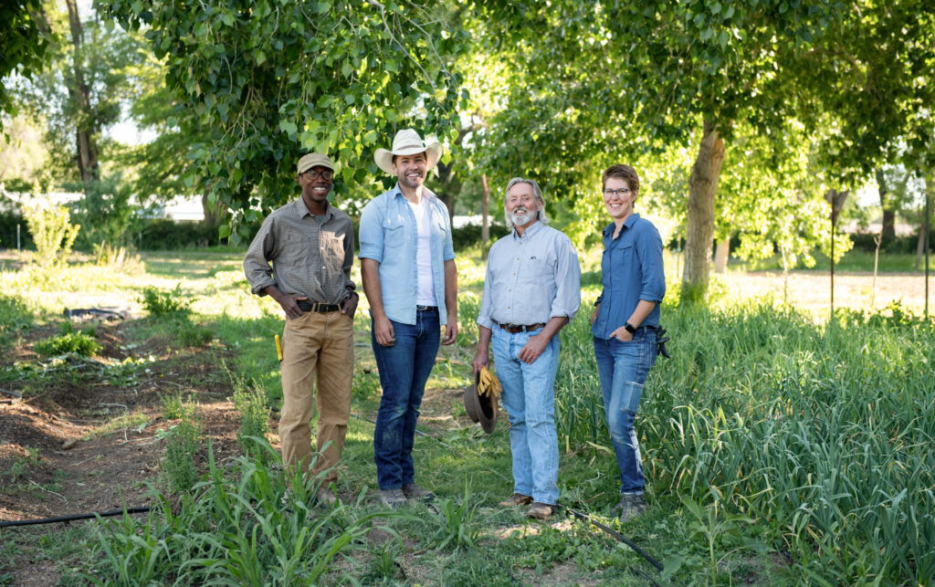 Brittenham (2nd from right) and other members of the farm team. Photo by Douglas Merriam.