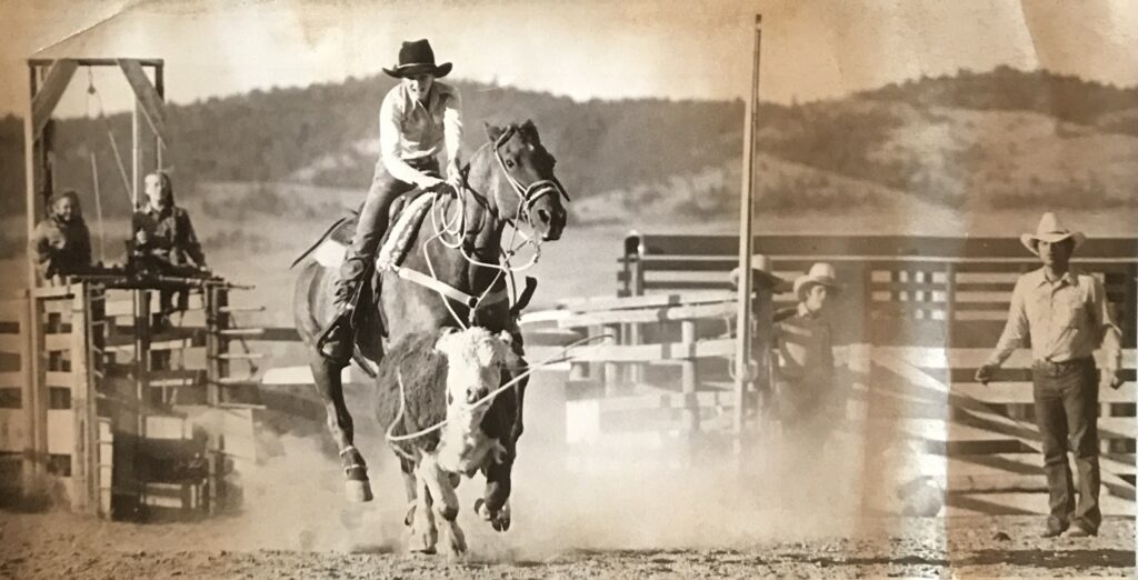 Tammy roping while her dad, Gordon, coaches.