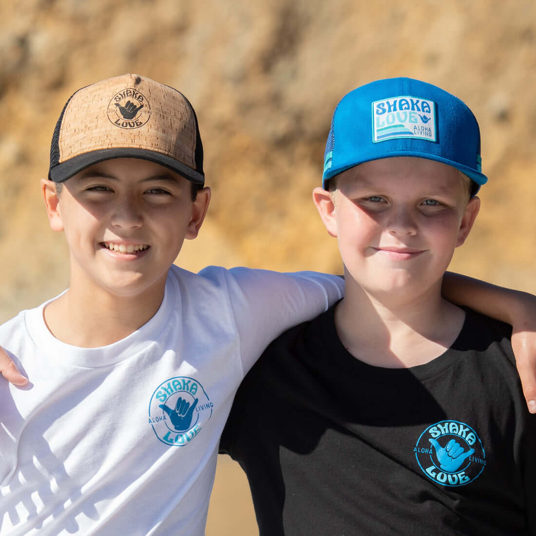 two cute kids wearing Shaka Love eco-friendly hats for sun protection, sustainable hats