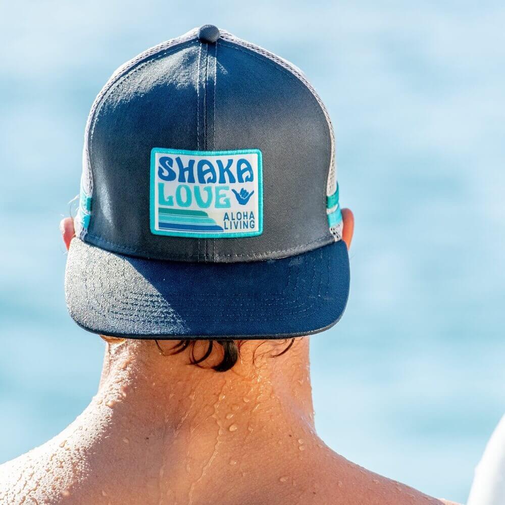 Young man wearing Shaka Love eco-friendly hat