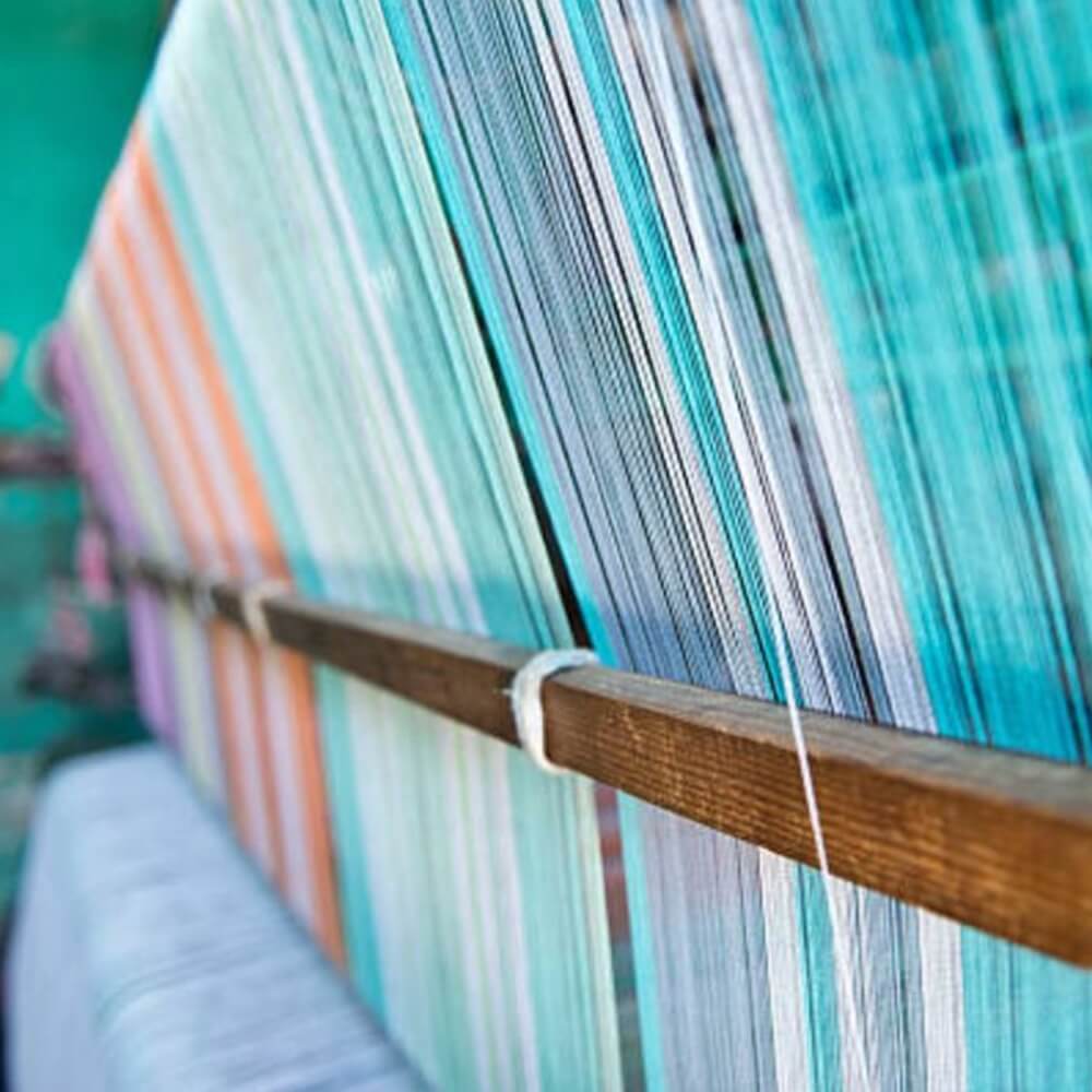 Close-up of a row of yarn on a loom, to craft Turkish towels