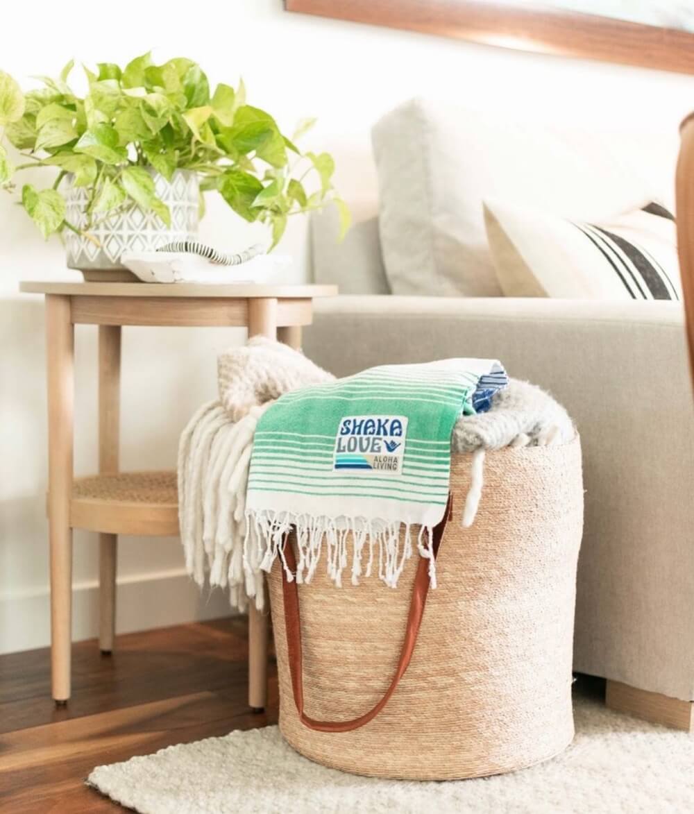 Cute bedroom decor with a green houseplant highlights how Turkish towels can be a stunning and versatile addition to your decor