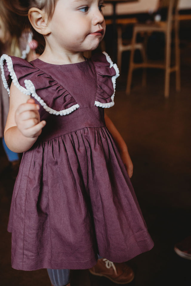 girls purple pinafore