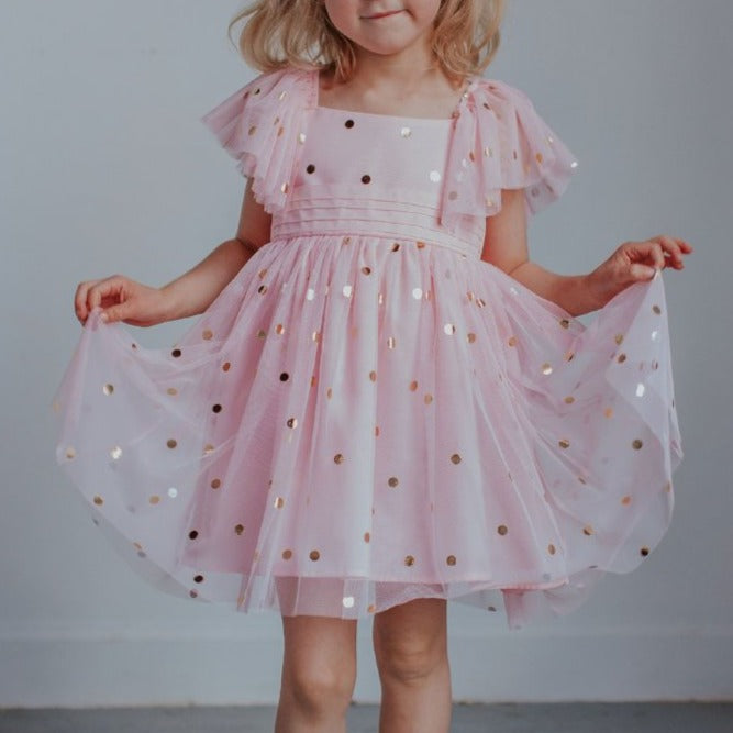 pink dress with gold polka dots