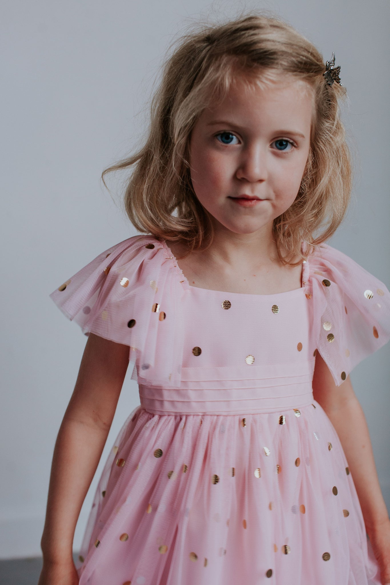 pink dress with gold polka dots