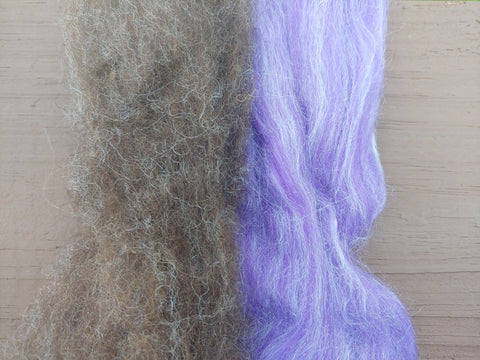 Dark Coopworth and Violet 80/20 Merino/Tussah on a painted wood background.