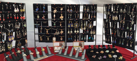 Views of earrings and necklaces on cards displayed on the wholesale racks