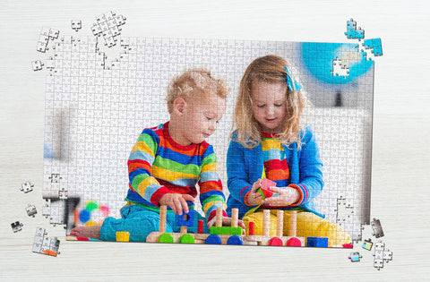 Two kids playing puzzle