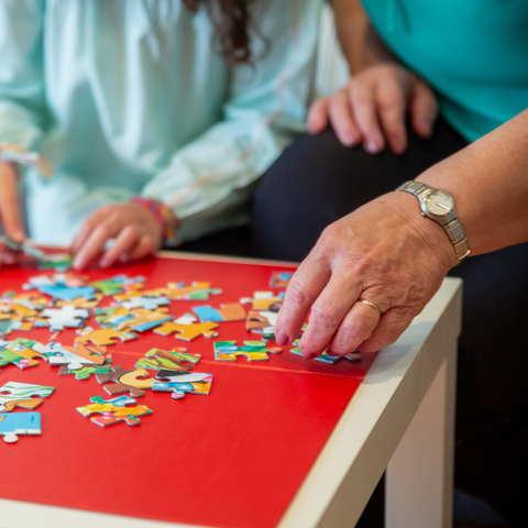 Adults Playing Puzzle