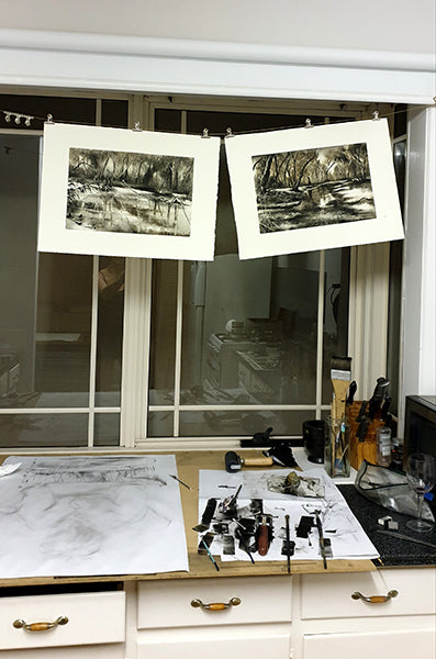 Marketa Kemp studio shot with tools and monotypes drying