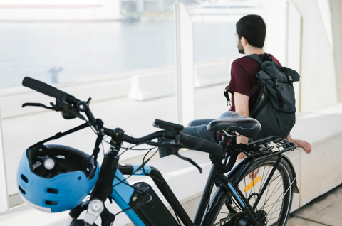 man sitting with bike, mid drive ebike kit