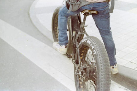 Person riding a fat tire electric bike on a dirt trail