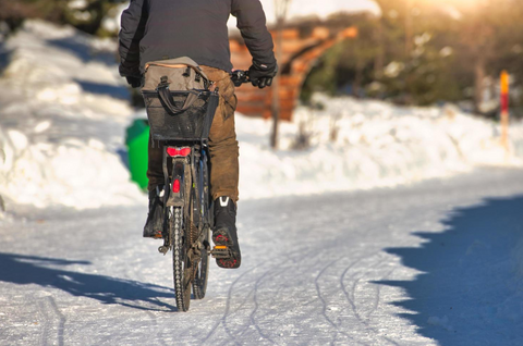 riding snowy bike road, riding electric bike snowy road, electric bike winter