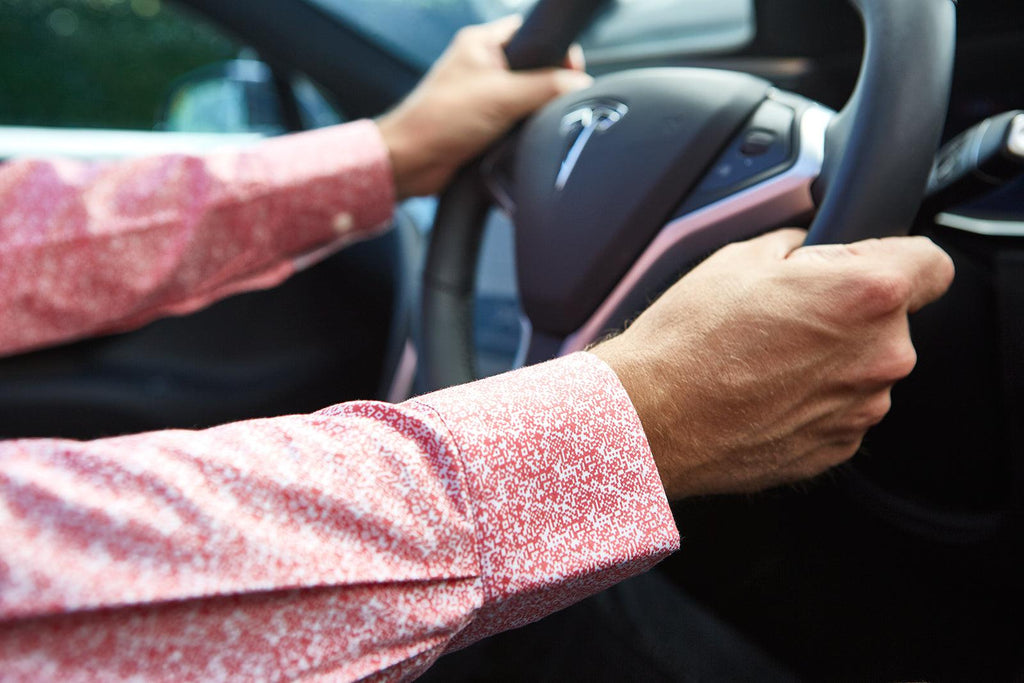 Pixel shirt driving Tesla car