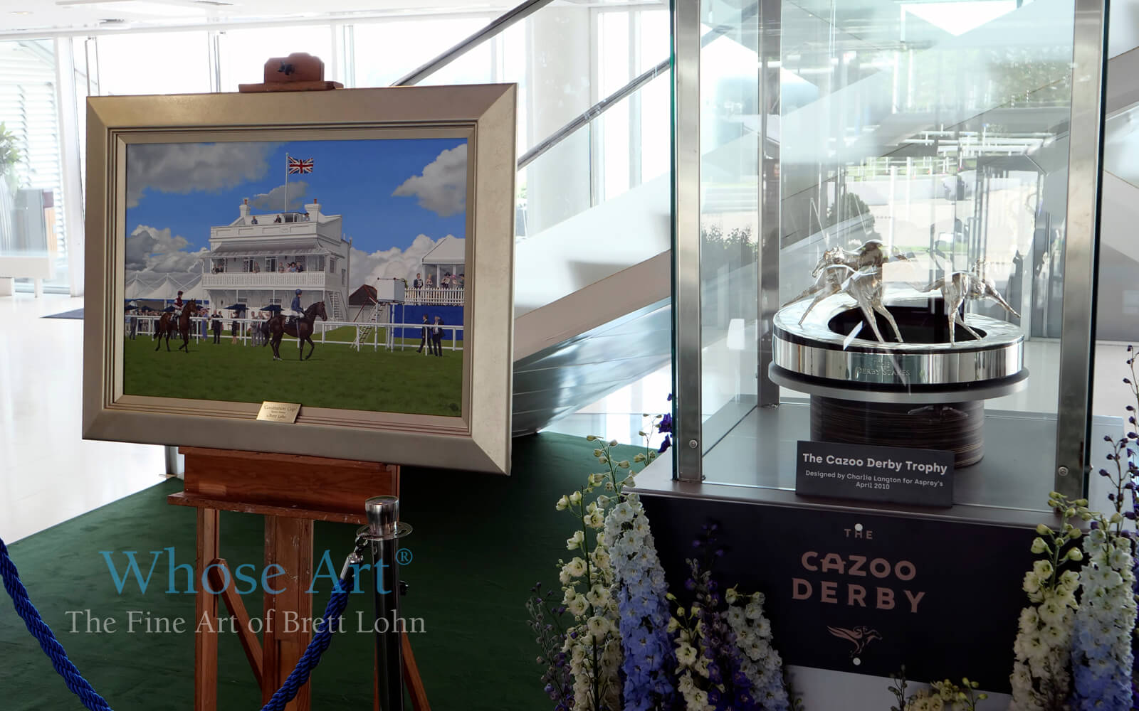 Epsom Derby Art Painting by Brett Lohn exhibited next to the Derby Trophy