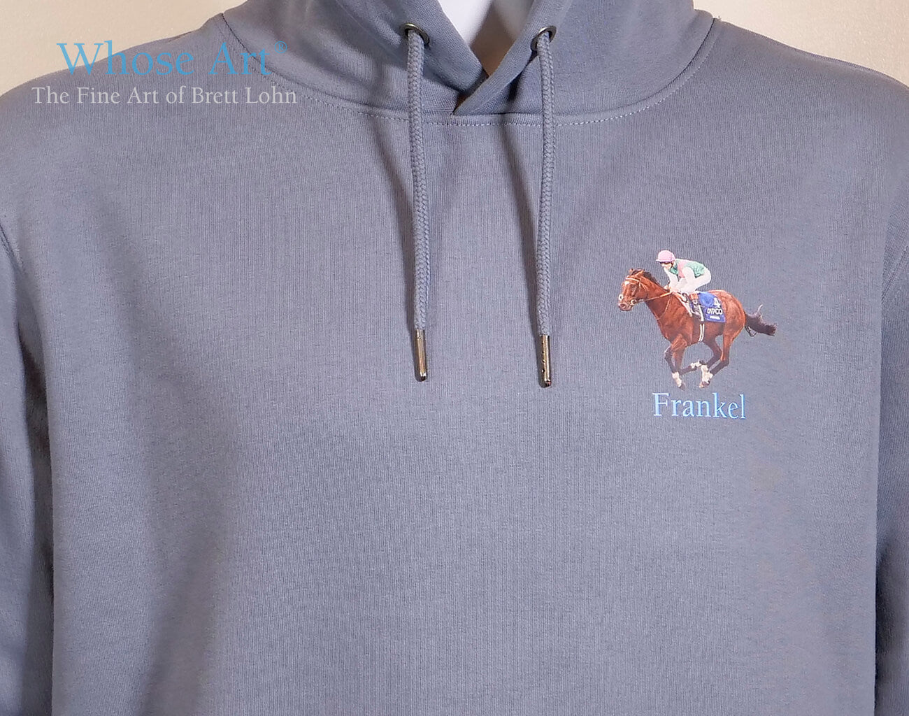 Frankel Horse memorabilia hoodie sweatshirt. Features a painting of Frankel galloping, with Tom Queally on board, printed on the front.