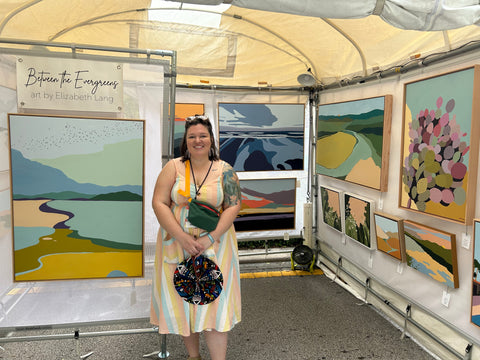 artist in booth at cocounut grove art festival