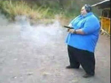 Giant fat guy shooting a gun