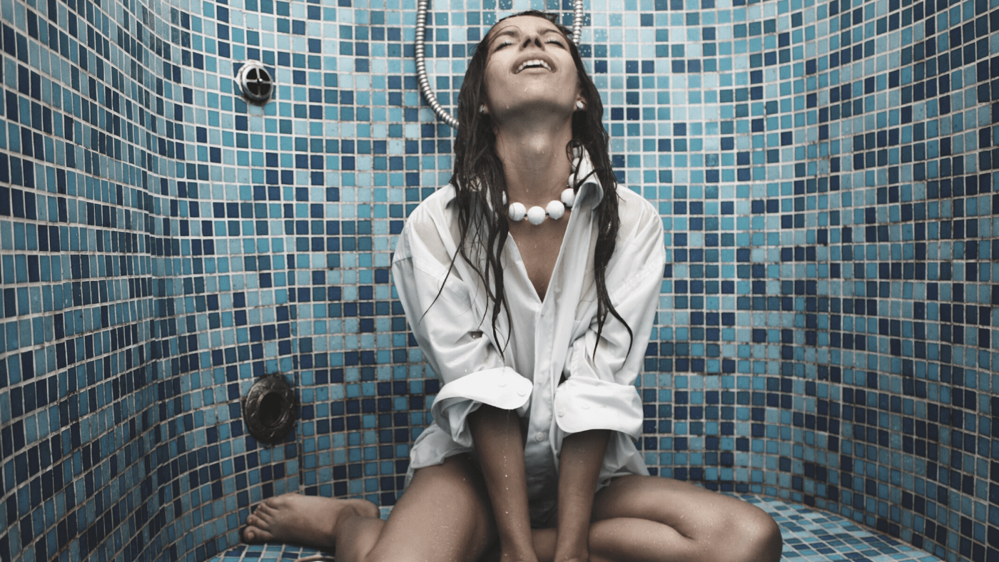 woman in shower practicing conscious bathing using intention setting