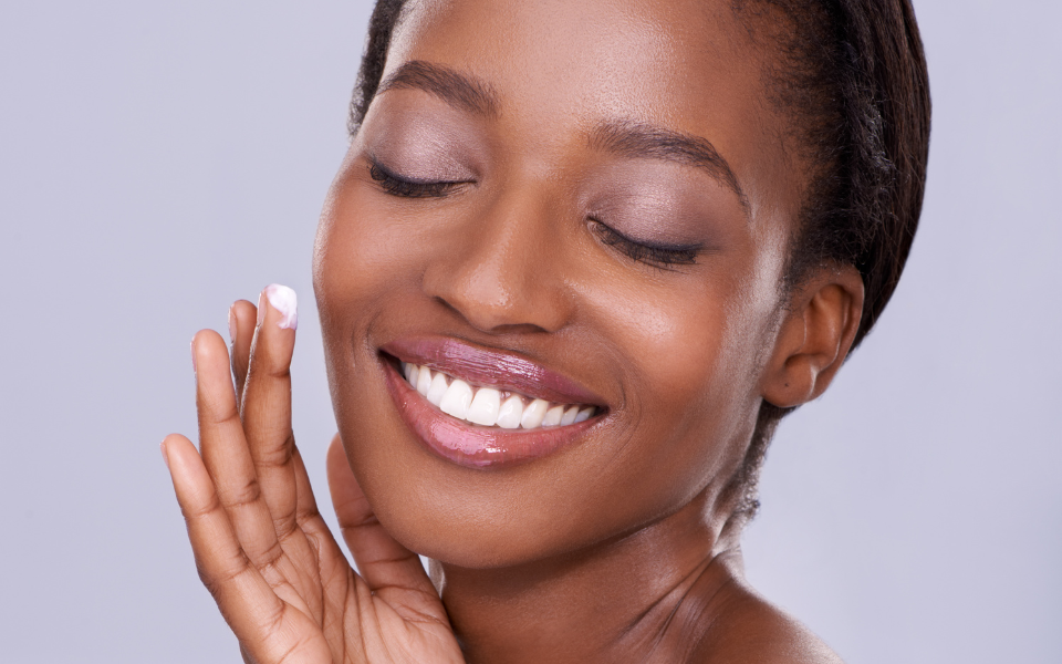 woman applying tallow to face