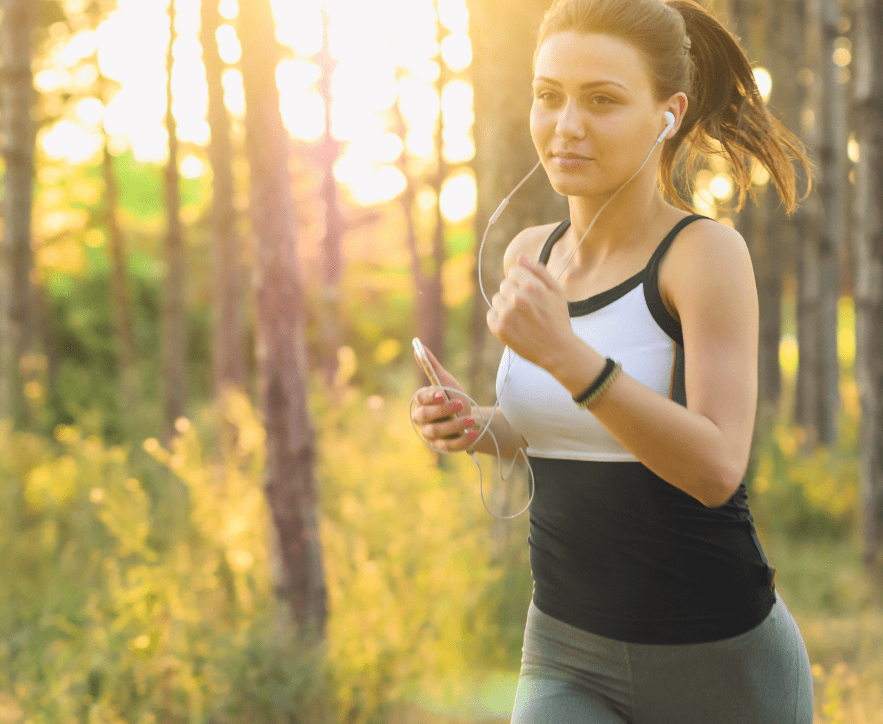 woman jogging in nature as self love practice