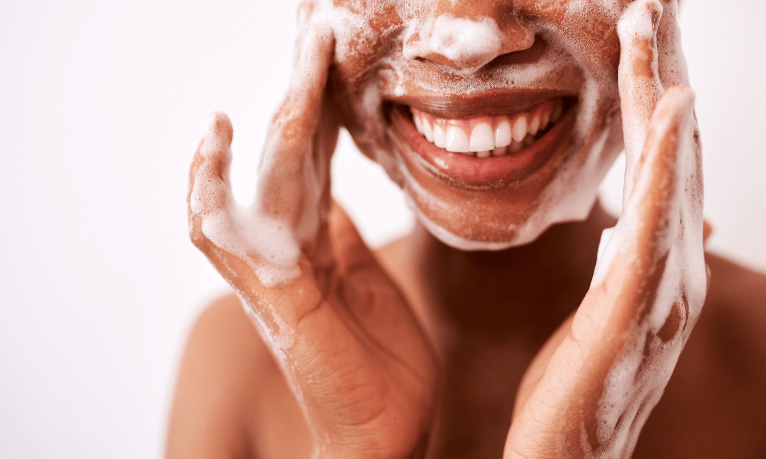women washing face with nefertem bar soap