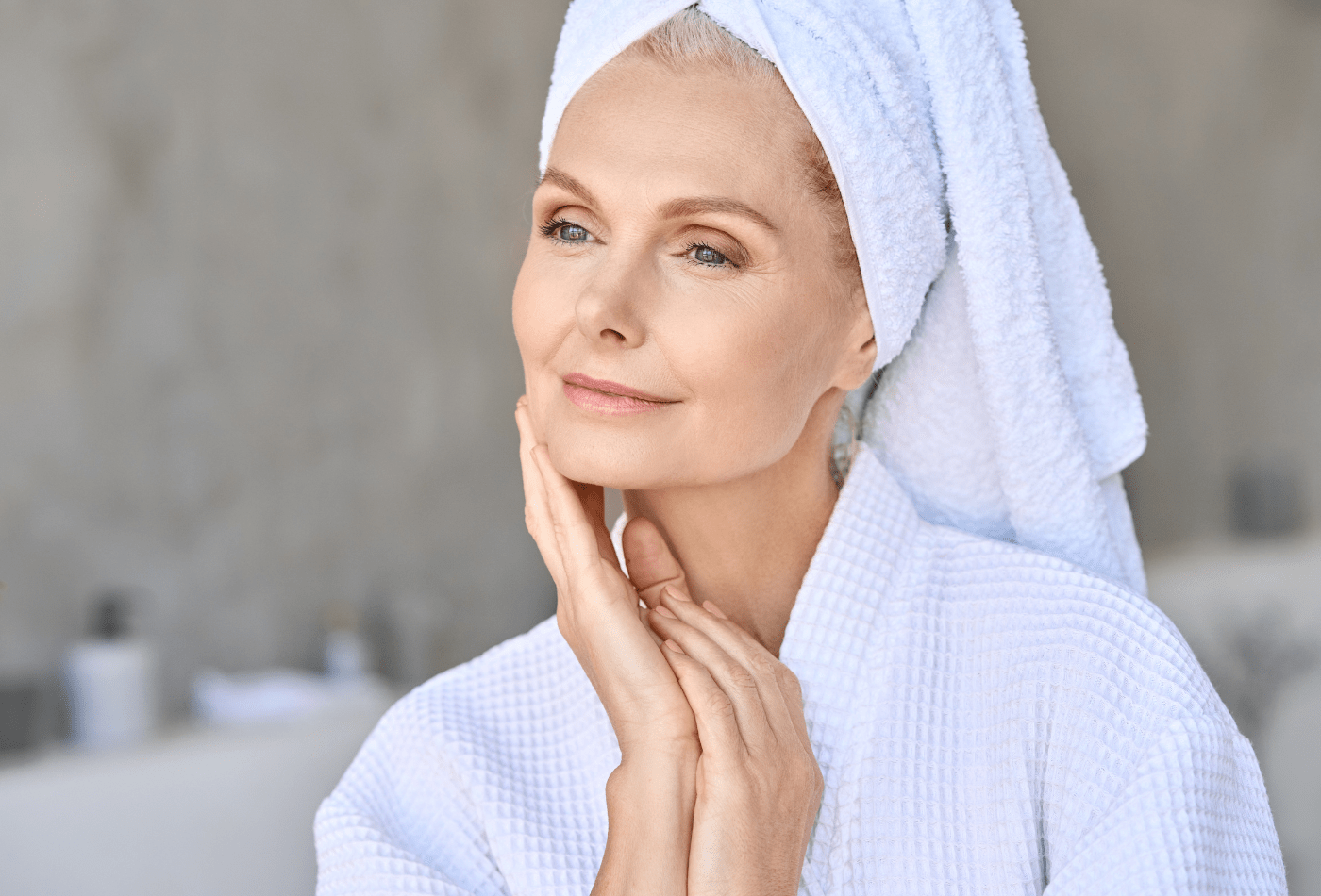 older women touching her skin after using nefertem products