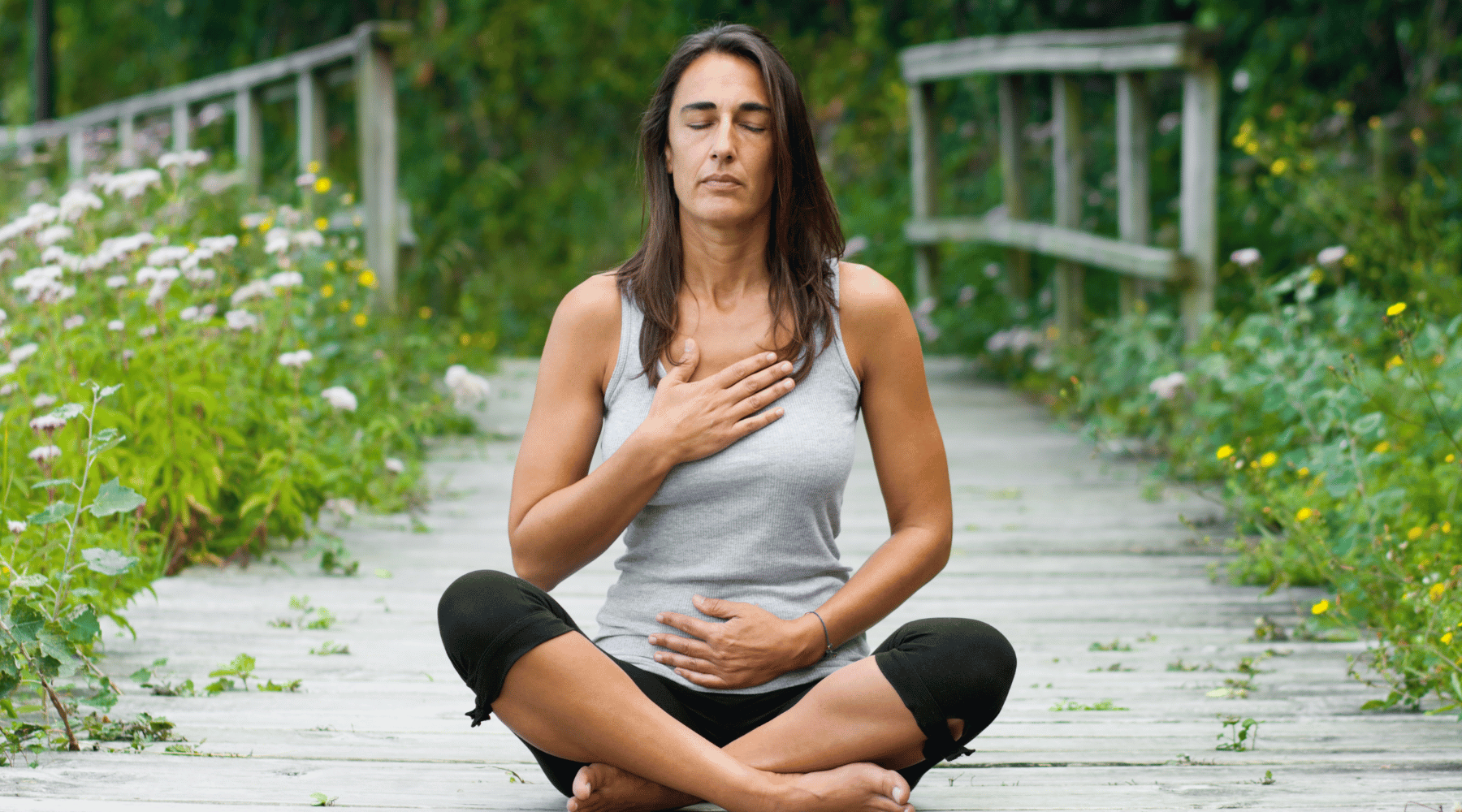 women meditating outdoors after using essential oils on skin